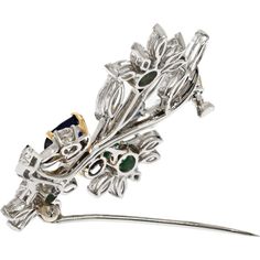 Let the essence of luxury envelop you with the enchanting Van Cleef & Arpels Platinum Bouquet Brooch, a masterpiece of elegance and craftsmanship. This exquisite brooch, signed and numbered by Van Cleef & Arpels, is a testament to the artistry of fine jewelry. Delicately designed with a floral motif, it is adorned with a mesmerizing array of diamonds, sapphires, and emeralds, each stone carefully selected for its exceptional quality and brilliance.What makes this brooch truly exceptional are the four sapphires, each accompanied by GIA reports confirming their natural beauty and rarity. One of these sapphires hails from Burma, adding a touch of exotic allure to this already stunning piece. The commitment to sourcing the finest gemstones and the meticulous attention to detail are evident in Elegant Multi-stone Brooches For Formal Occasions, Fine Jewelry Multi-stone Wedding Brooches, Elegant Diamond Multi-stone Brooch, Elegant Multi-stone Brooches For Gifts, Emerald Brooch, Bouquet Brooch, Emerald Birthstone, Van Cleef And Arpels, Brooch Bouquets