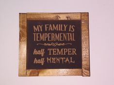 a wooden sign that says, my family is temporary half termer half mental on it