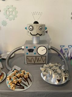 a robot themed birthday party with cookies and desserts