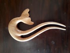 a wooden object that is shaped like a cat