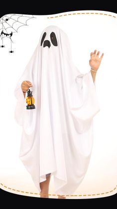 a person in a ghost costume holding a toy