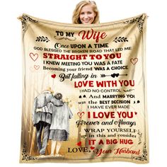 a woman holding a blanket with the words to my wife on it and an image of two