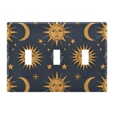 the sun and moon light switch plate cover is shown in black with gold stars on it