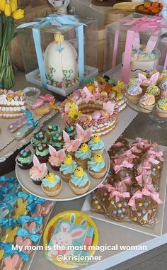 a table filled with lots of cupcakes and cakes