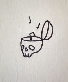 a drawing of a skull with a spoon in it's mouth