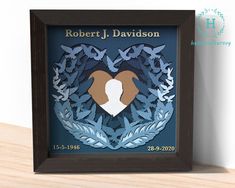 a wooden frame with an image of a dog in the center and leaves surrounding it