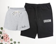 two pairs of black and grey shorts with the word groom written on them