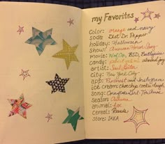 an open notebook with many different colored stars on the page, and writing in cursive ink