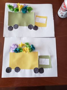 two paper bags with flowers on them and a truck made out of construction paper sitting on top of a table