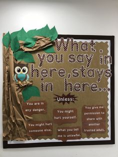 a bulletin board with an owl sitting on a tree branch and the words, what you say in there stays in here