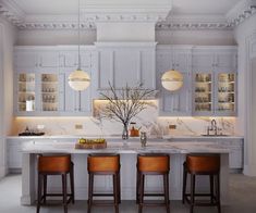 a kitchen with marble counter tops and wooden stools