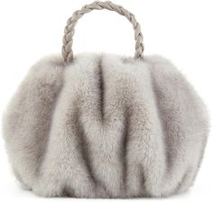 This handbag is made with luxuriously soft faux fur and features a braided handle, making it both fashionable and comfortable. The beige color complements any outfit for a look that is effortlessly elegant. The outside of the tote bag is smooth and soft artificial fur,Simple and environmentally friendly. 11.3 x 10.55 x 3.66 inches Elegant Winter Tote Shoulder Bag, Elegant Winter Shoulder Bag With Faux Fur Lining, Elegant Beige Shoulder Bag For Winter, Elegant Winter Shoulder Bag For Shopping, Chic Shoulder Bag With Faux Fur Lining For Shopping, Elegant Winter Tote Bag, Elegant Evening Shoulder Bag With Faux Fur Lining, Winter Evening Bag With Top Handle, Elegant Evening Bags With Faux Fur Lining