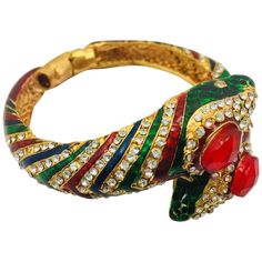 Stunning wrap around snake hinged bangle bracelet is encrusted with sparkling cubic zircon and detailed with bold rich green, red and blue enamel. Approx: 1.13"W x 2.25" FOLLOW MEGHNA JEWELS storefront to view the latest collection & exclusive pieces. Meghna Jewels is proudly rated as a Top Seller on 1stDibs with 5 star customer reviews. All items manufactured by us are handmade and can be customized or redesigned. Wrap Around Snake, Bower Bird, Modern Bracelets, The Bangles, Rich Green, Couture Vintage, Themed Jewelry, Exclusive Jewelry, Hinged Bangle