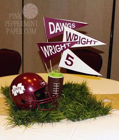 a football themed centerpiece on top of a table