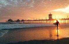 a man is walking on the beach with his surfboard in front of him and text that reads 3 reasons you have to visit southern california