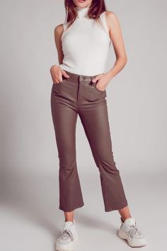 There a few necessities in the chic woman’s wardrobe, one of which is a great pair of leather or faux leather pants. With a high waist, flare legs, and a touch of classic color provided in their fabulous beige hue, these stylish pants boast of five functional pockets, a zip fastening, belt loops, and faux leather fabric that is made from 20% Polyester, 76% Viscose, and 5% Elastane. We style them in our photos with our Knitted Tank Jumper in Cream. The model is 5’6” with measurements of 32-24-25 Minimalist Winter Wardrobe, Leather Flare Pants, Glam Doll, Boy Outerwear, Minimalist Dresses, Stylish Pants, Faux Leather Fabric, Faux Leather Pants, Chic Woman