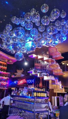 a bar filled with lots of bubbles hanging from the ceiling