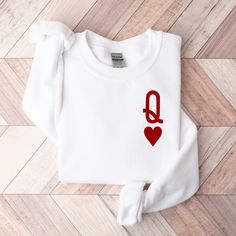 The coziest Queen of Hearts Sweatshirt MATERIAL ✨ Sweatshirt sizes are Unisex, please refer to sizing chart in listing photos ✨ 50% cotton, 50% polyester ✨ Medium fabric weight CARE ✨ Machine wash: warm (max 40C or 105F) ✨ Do not iron ABOUT My love for design and clothing is what inspired the creation of this store.  During lockdown, I had so much free time and I have always had a dream to start my own business, and from this, my store was born and I couldn't be more grateful. SHIPPING, REFUNDS Christmas Graphic Design, Queen Queen, Queen Shirt, White Crewneck Sweatshirt, Queen And King, Christmas T Shirt Design, King Of Hearts, Queen Shirts, White Fleece