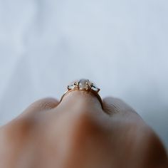 This Penelope Ring is the perfect big sister to our Penny Ring. The shape and colors of this ring are classic and ethereal. With a rose cut labradorite cente stone flanked by two pear shaped aquamarines, you're sure to have a timeless ring to last generations. Details 14k gold (yellow, rose or white) Rose cut Labradorite measures about 5mm Pear aquamarines measure about 5x3mm Materials: Aquamarine, labradorite, 14k gold Need your ring bigger than whats offered? An additional fee will be applied 14k Gold Opal Ring, Gold Chain Choker, Timeless Ring, Dainty Choker, Opal Ring Gold, Labradorite Ring, Gold Choker, Aqua Marine, Charm Rings