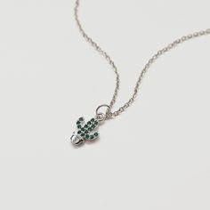 Beautiful tiny cactus necklace made of green CZ stone silver color cactus charm with rhodium plated brass chain. Cute size charm necklace is great for gift or yourself. Your necklace will ship in a  gift box.    ♥ Cactus charm 1/4" x 3/8"  ♥ Chain length 14"-18"  ♥ Rhodium plated over brass / Cubic Zirconia  ♥  See more Rudiana Accessories  Rudiana.etsy.com Minimalist Silver Charm Necklace With Emerald, Green Sterling Silver Charm Necklace For May Birthstone, Dainty Green Sterling Silver Charm Necklace, Green Sterling Silver Charm Necklace With Lobster Clasp, Green Sterling Silver Charm Necklace, Personalized Green Sterling Silver Charm Necklaces, Green Sterling Silver Necklaces With Charms, Dainty Silver Charm Necklace For May Birthstone, Green Sterling Silver Necklace With Charms