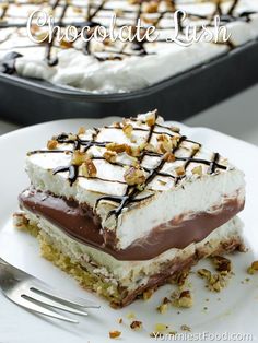 a piece of chocolate and marshmallow ice cream cake on a plate with a fork