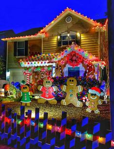 a house decorated with christmas lights and gingerbreads