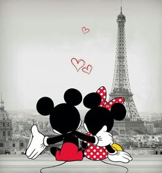 two mickey and minnie mouses hugging in front of the eiffel tower, paris