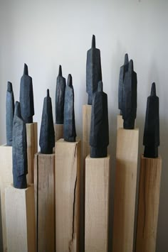 several pieces of wood are stacked on top of each other in order to form sculptures