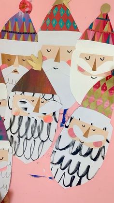 paper cut out of santa clauss on a pink background