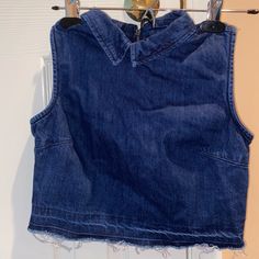 Never Worn Denim Collared Crop Top With Zipper In The Back And Fringe Bottom! Great Condition Washed And Smoke-Free Home! Size: Xs/4 Trendy Dark Wash Sleeveless Top, Dark Wash Sleeveless Casual Top, Trendy Sleeveless Dark Wash Top, Fitted Cotton Cutoff Top, Casual Cropped Denim Blue Vest, Denim Cutoff Tops With Frayed Hem, Trendy Cutoff Top With Frayed Hem, Trendy Cutoff Denim Top, Casual Fitted Cutoff Tops