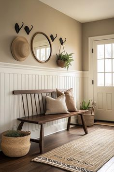 a wooden bench sitting in the middle of a living room next to a rug and potted plant