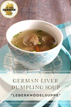 a bowl of german liver dumpling soup on a blue and white plate with the title above it