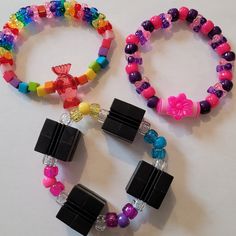 I have been collecting and making kandi since my early rave days in 2000. I will be making special kandi sets that include vintage beads from my collection. Have a little piece of kandi history. I created a playlist on my YouTube channel Kandi Toybox (My kandi bead collection) if you would like to see my collection! These kandi bracelets are made with mostly vintage beads from the 90s,early 2000s and some new beads. New beads are the glitter pony beads. Includes 3 bracelets. Bracelet size 7-8 in Rave Style Plastic Beaded Bracelets, Pink Plastic Rave Bracelets, Multicolor Plastic Beaded Bracelets For Rave, Multicolor Plastic Bracelets For Rave, Multicolor Plastic Rave Bracelets, Rainbow Beaded Bracelets For Rave, Rave Style Multicolor Plastic Bracelets, Pink Beaded Rave Jewelry, Multicolor Plastic Rave Jewelry