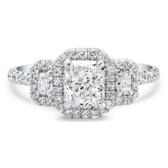 a cushion cut diamond ring with three halos