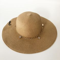 Nwt Juicy Couture Woven Floppy Sun Beach Straw Hat With Goldtone Chain & Charms. New With Tags. A Tan/Beige Straw Hat With Gold Chains And Charms To Accent The Band. Nice Wide Brim To Protect You From The Sun. Add A Little Glam And Bling To The Beach Or Pool. Great Deal On Shipping When You Buy This Item (Which Will Need A Larger Box For Shipping) On Poshmark Hat Jewelry Accessories, Chic Sun Hat For Vacation, Elegant One Size Summer Hats, Elegant Gold Sun Hat For Summer, Chic Straw Hat For Beach Party, Chic Sun Hat For Beach Season Party, Chic Sun Hat For Beach Party, Trendy Summer Party Sun Hat, Chic Party Sun Hat For Beach Season