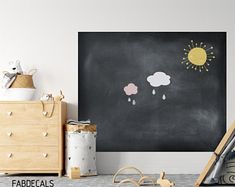 a child's room with chalkboard and toys