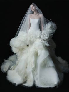 a woman in a wedding dress and veil