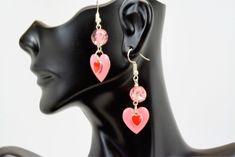 Pink enamel heart dangle earrings.  Large pink enamel heart with a smaller red enamel heart floating on the pink heart.  Some pink crackle beads and you have one of a kind pair of Valentine earrings.  These can be worn anytime, not just Valetine's Day.  Perfect gift for you sweetheart.  They are approximately 2 inches in length from the top of the ear wire. Heart Charm Enamel Earrings, Heart-shaped Enamel Earrings With Charm, Valentine's Day Heart Charm Enamel Earrings, Pink Double Heart Pierced Jewelry, Pink Enamel Jewelry With Matching Earrings, Pink Enamel Dangle Jewelry, Valentine's Day Enamel Dangle Earrings, Pink Heart Earrings With Ear Wire For Valentine's Day, Pink Heart Charm Drop Earrings