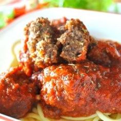 spaghetti and meatballs with sauce in a bowl