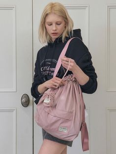 CITYBREEZE is a brand that presents contemporary high-end casual styles based on the “effortless chic” mood.- Set item with backpack and keyring bag- Lightweight 100% nylon used- Brand logo label is added on the bottom- Drawstring type open and closing Multifunctional Pink Bag For On-the-go, Pink Shoulder Bag With Pockets For On-the-go, Trendy Nylon Gym Bag For Travel, Casual Large Capacity Pink Backpack, Multifunctional Large Capacity Pink Shoulder Bag, Pink Nylon Bag With Pockets, Pink Nylon Backpack With Pockets, Pink Nylon Shoulder Bag With Pockets, Casual Pink Gym Bag With Large Capacity