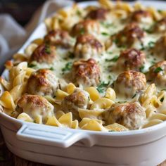 a casserole dish filled with meatballs and cheese