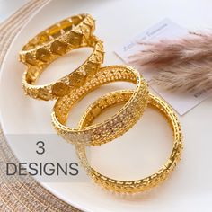 These bangles gold plated stacking gold bangles / gold bracelet are a perfect gift for a special women. Treat yourself or a loved one. These unique bangles will enhance any outfit. Trendy Designed Suitable for all Occasions, Wedding, Party, Engagement , Bridle  Jewelry, Birthday Gift Size: 2.45 inches width : 1.6cm 24K Gold Plated High quality Not a  solid Gold can open for easy use These are made of high quality materials 24K gold plated and it will NOT tarnish nor discolor for a long time. High quality gold plated jewelry is a great alternative to solid gold jewelry.  very affordable price. This item is hypoallergenic so it won't irritate sensitive skin. Suitable for all occasions 🦋Jewelry Care:  As with all pieces that are not real gold, it is advised that you take proper jewelry care Elegant Gold-plated Gold Bangle, Gold Plated Bracelet With Intricate Design, Gold-plated Bracelet With Intricate Design, Gold-plated Bangle Bracelet With Intricate Design, Gold Plated Bangle Bracelet With Intricate Design, Gold Plated Bangle With Intricate Design, Gold-plated Bangle With Intricate Design, Stackable Gold Plated Bangle Bracelet, Gold Bangle Bracelets For Festive Occasions