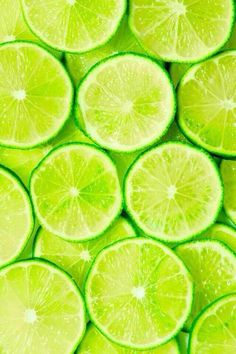 lime slices are stacked up in the shape of a square, with green and yellow highlights