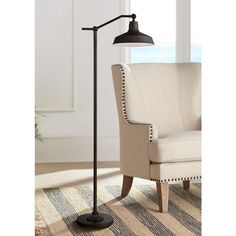 the floor lamp is next to a chair