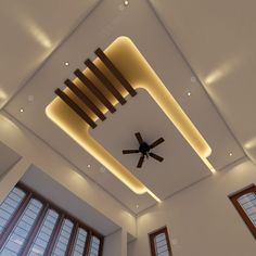 a ceiling fan in the middle of a room