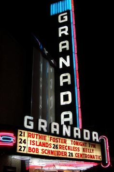 the marquee for grandad is lit up at night