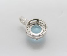 Vintage Sterling Silver Round cut Aquamarine & White Topaz Pendant...Marked 925...Total of weights 1.5grams...Measure of stone 7.5MM...Measure of Pendant H 5/8'' W 3/8''...It's in very good condition. Round Blue Topaz Gemstones With Prong Setting, Round Topaz Gemstones With Prong Setting, Round Cubic Zirconia Gemstones For Jewelry Making, Blue Topaz Jewelry With Round Accent Stones, Silver Round Blue Topaz Gemstones, Round Silver Blue Topaz Gemstones, Blue Topaz Round Stone Jewelry With Prong Setting, Silver Blue Topaz Gemstones, Round Shape, Silver Blue Topaz Round Gemstones