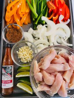 the tray has several different types of vegetables and seasonings on it, including peppers