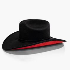 Black Cowboy Hat with Red Under Brim by AB.LION Western meets contemporary. Our take on a western classic, made from the same materials used on our flagship rancher hat, with a red under brim. Trimmed with a Minimal Mexican Suede Hat Band. Made from stiffened Mexican suede Spot / specialist clean Brim width: 4″ / 10.16 Black And Red Cowboy Hat, Rigid Wide Brim Top Hat For Rodeo, Western Boater Hat For Rodeo With Flat Crown, Western Flat Crown Boater Hat For Rodeo, Western Style Boater Hat With Flat Crown For Rodeo, Western Boater Hat With Flat Crown For Country Events, Country Style Boater Hat With Flat Brim For Rodeo, Country Style Flat Brim Boater Hat For Rodeo, Western Boater Hat With Curved Brim