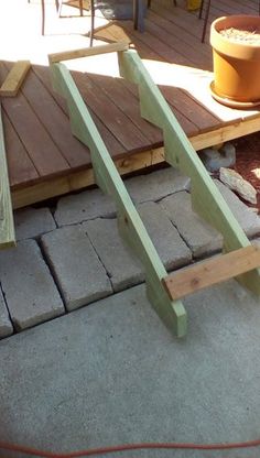 a wooden bench sitting on top of a patio